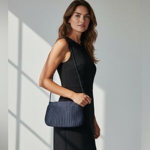 Pacific Connections black pleated evening bag.